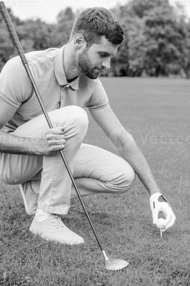 Golfer Setting Ball On Tee 3